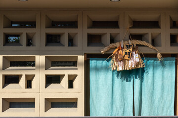 Japanese culture fetish hanging in front of building