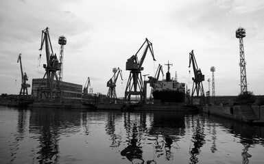 Silhouettes of portal cranes of Varna port, Bulgaria. Black and white