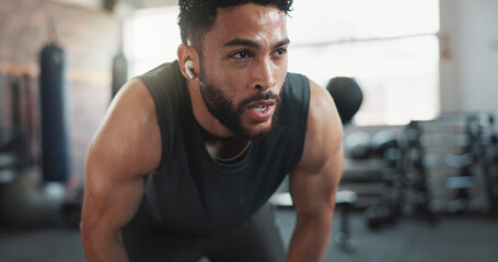 Man, sweating and tired in recovery for workout, intense exercise and wellness with fatigue. Male person, breathing and exhausted as athlete for health, challenge or training in fitness, sport or gym