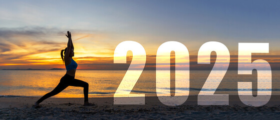 Happy new year card 2025. Silhouette lifestyle woman yoga practicing yoga standing as part of Number 2025 near the beach at sunset. Healthy and Holiday Concept