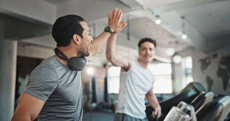 Men, fitness or high five with partner on treadmill for running exercise, workout or training at gym. Male people, friends or runners with teamwork for winning, achievement or wellness at health club