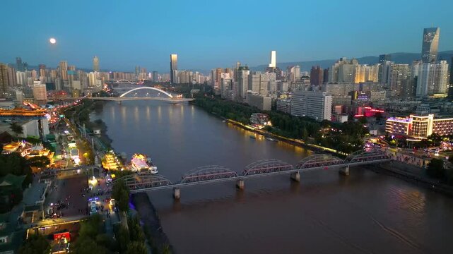 LANZHOU, CHINA- The aerial cityscape of  downtown and yellow river in Gansu province, Lanzhou city. The must landmark to visit of tourists.