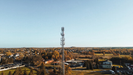 Telecommunication tower amidst countryside fields