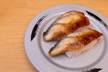 Unagi Sushi, made with Japanese bbq grilled freshwater eel, a savory unagi sauce, and seasoned sushi rice.