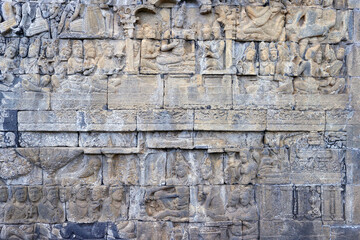 Fototapeta premium Borobudur, 9th-century Mahayana Buddhist temple. UNESCO World Heritage. Bas-relief dispicting the life of Buddha. Java. Indonesia.
