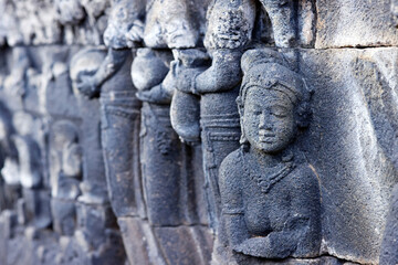 Borobudur, 9th-century Mahayana Buddhist temple. UNESCO World Heritage.  Bas-relief dispicting the life of Buddha.  Java. Indonesia.