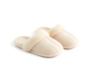 A pair of white slippers resting on a clean white surface, showcasing their simple and elegant design.