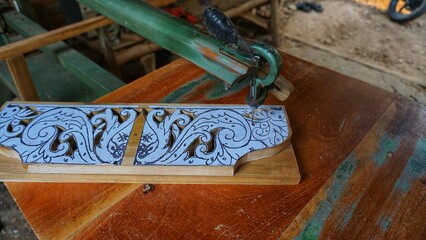 The initial process of making traditional Javanese Gebyok is made from whole wood which is cut and...