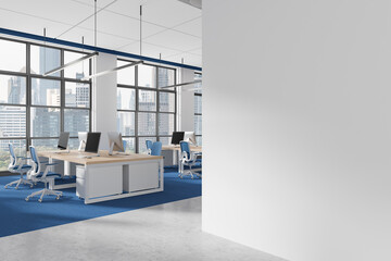 Modern office space with empty white wall and open workstation area in city background. 3D Rendering