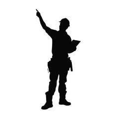 A man in a military uniform is pointing to something. He is holding a book in his hand