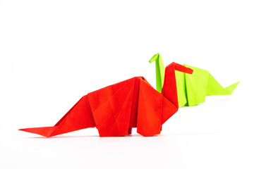 Paper dinosaur on white background. paper crafts. origami dinosaur. origami art. © Denis