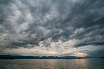 Obraz premium beautiful clouds over Lake Baikal at sunset