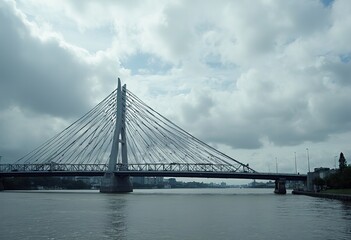 Fototapeta premium A modern suspension bridge with a geometric, triangular pattern on the underside of the bridge deck