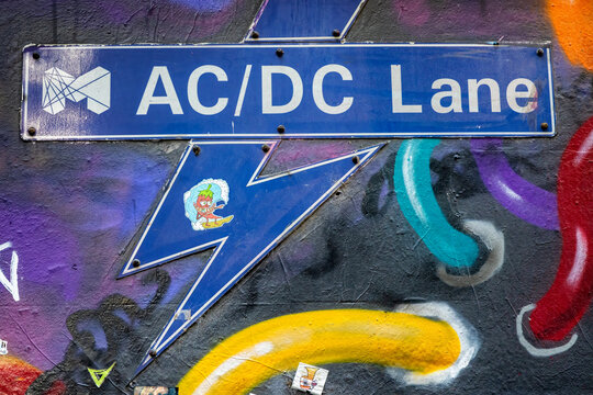 Melbourne, Australia - 20 Jan 2023: Street sign for AC/DC Lane, a back street in the CBD district and frequented by graffiti artists. Named as a tribute to the famous Australian hard rock band AC/DC