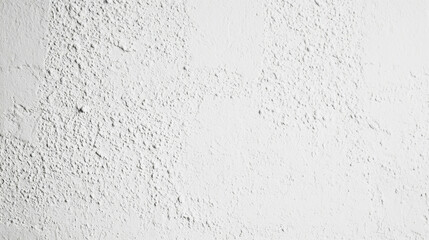 Obraz premium Close-up of a white fine-grained plaster wall texture with subtle shadows and realistic details