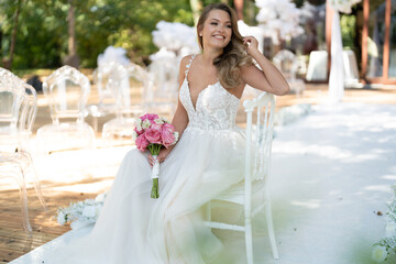 Naklejka premium The bride sits on the white chair