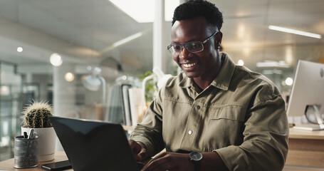 Black man, office and laptop with typing, research and happiness in working late at night on...