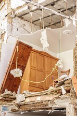 House damaged by the flood caused by the intense rains of the Dana over the Valencian Community with furniture and debris and cordoned off by police tape