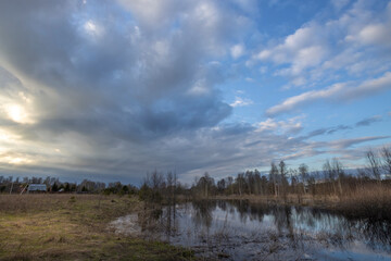Cloudy sky with a house in the background