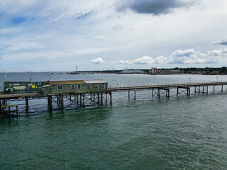 Obraz premium High Angle View of Hythe Town's Ocean and Beach in Kent, England Great Britain. Aerial Footage Was Captured with Drone's Camera During Hot Weather of May 17th, 2024