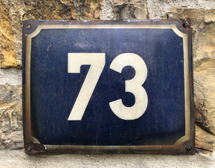 Blue sign that says 73