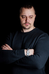 Thoughtful Man Posing in Dark Background