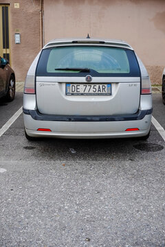 Silver saab 9-3 sportcombi 1.9 tid parked in urban setting, showcasing rear view from designated parking spot on asphalt surface