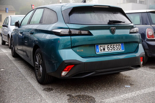 Showcasing the modern design and eco-friendly technology of the 2022 peugeot 308 sw plug-in hybrid in okenite green