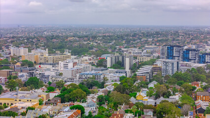 Obraz premium Aerial drone view over Sydney inner suburb of Glebe and Annandale close to Sydney Harbour NSW Australia beautiful colourful roof and tree lined streets green orange purple