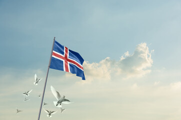 Iceland flag waving with flying doves in beautiful sky. Iceland flag for Republic Day and...