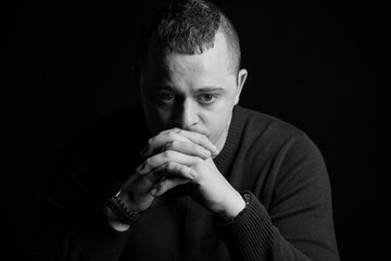 Introspective Man in Black and White Portrait