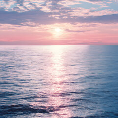 Fototapeta premium sunset over calm ocean waters with pink and blue hues, reflecting serenity and natural beauty, ideal for peaceful wallpapers, meditation, and coastal photography themes