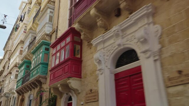 Valetta, Malta. A row of colourful wooden traditional Maltese balconies.
