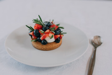 a delectable tartlet filled with a smooth, creamy filling and topped with an assortment of fresh,...