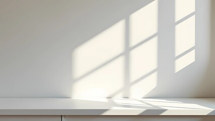 Fototapeta premium Interior of white room with empty table, sunlight casts shadows on white wall, clean space