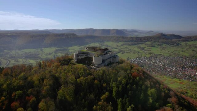 Aerial footage of Hohenneuffen castle. Hohenneuffen Castle is a ruined castle in the northern foothills of the Swabian Alb, above the town of Neuffen in the district of Esslingen in Baden-W&uuml;rttemberg.