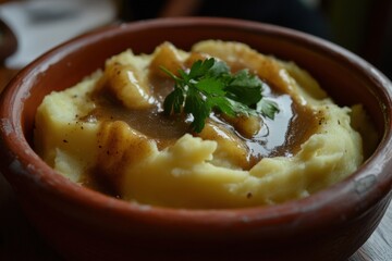 creamy mashed potatoes with gravy and fresh herbs