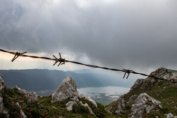 A lake behind barbed wire