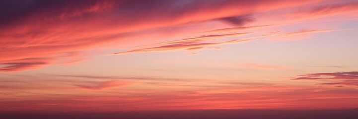 Obraz premium Abstract sky filled with vibrant hues of orange, pink, and purple as the sun sets behind the horizon, clouds, atmosphere