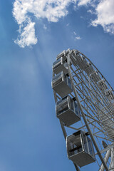 Ferris wheel attraction in sunny weather