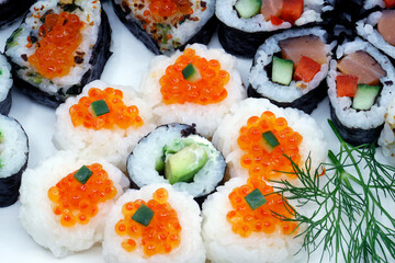Different Japanese rolls and sushi on a plate. Japanese food. © Godong Photo