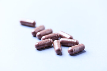 Lutein capsules. Dietary supplement on bright background. Soft focus. Close up. Copy space	