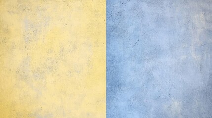 Yellow and blue painted concrete wall creating a striking two-tone background, showcasing a textured and vibrant surface ideal for design projects