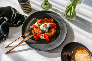 Light breakfast in a restaurant with coffee, poached egg and salmon gravlax