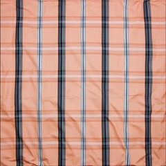 Peach, white, and grey plaid fabric with subtle wrinkles.