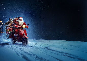 Santa Claus on a motorcycle with a bag of presents riding down the street on Christmas night
