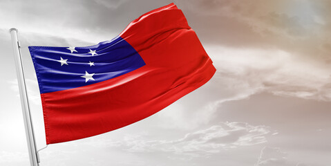 Samoa national flag cloth fabric waving on beautiful grey Background.