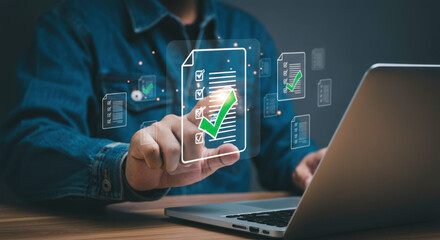 Digital document approval process with futuristic glowing icons on laptop screen.