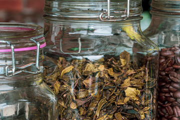 Fermented Stock Butterfly Pea Tea that has been dried and stored in a jar, tea in a glass