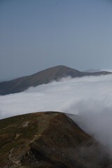 Cloud in a top mountain. Fog on the peak